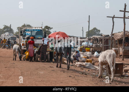 A photo of vendor selling various goods (including livestock such as horses and donkeys) in Bolgatanga (Bolga, Ghana, West Africa Stock Photo