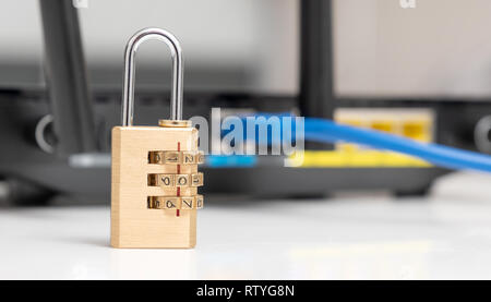 Network and data protection concept with padlock. Internet router or switch with cable plugged in. Stock Photo