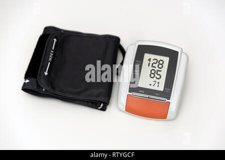Blood pressure measurement, digital gauge medical equipment isolated on  white background. Health and medicine concept Stock Photo - Alamy