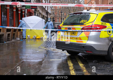 Soho, London, UK - March 3, 2019: Forensic officers at the crime scene outside in Romilly Street in Soho. Credit: michelmond/Alamy Live News Stock Photo