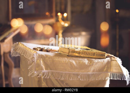 Church attribute a golden Bible with lock on the altar Stock Photo