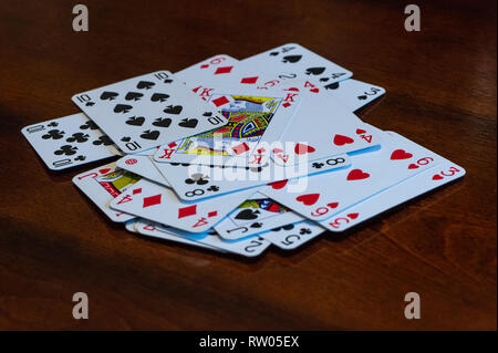 Playing cards on wooden table Stock Photo
