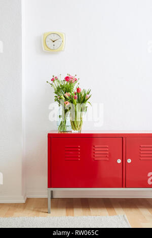minimalist home decoration flowers on metal locker Stock Photo