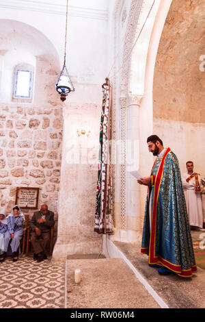 Midyat, Mardin province, Turkey : Faithful attend the mass service at a Syriac Orthodox Church in the old town of Mardin. Although now a minority of l Stock Photo