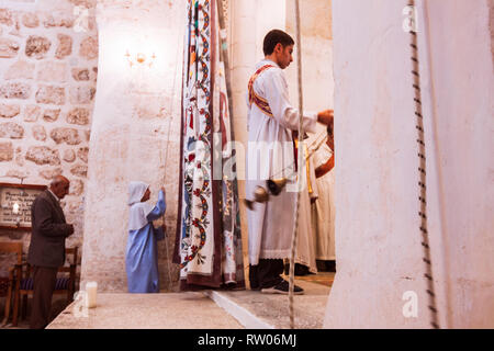 Midyat, Mardin province, Turkey : Faithful attend the mass service at a Syriac Orthodox Church in the old town of Mardin. Although now a minority of l Stock Photo
