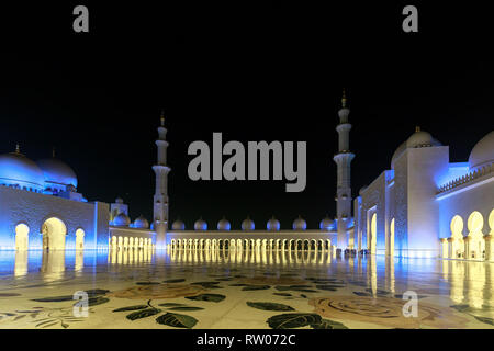 ABU DHABI, UAE, JANUARY 10, 2019: Magnificent view of the inner area of The Sheikh Zayed Grand Mosque, beautifully illuminated with blue light Stock Photo