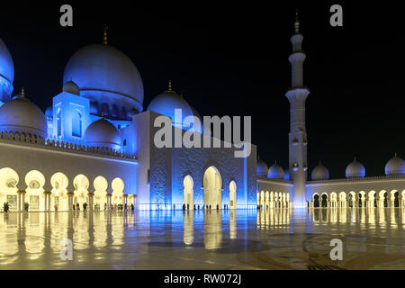 ABU DHABI, UAE, JANUARY 10, 2019: Magnificent view of the inner area of The Sheikh Zayed Grand Mosque, beautifully illuminated with blue light Stock Photo