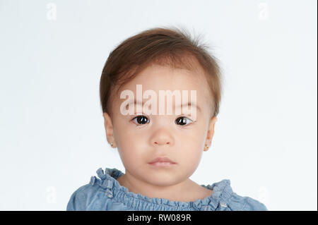 Portrait of little girl with tears isolated on white background Stock Photo