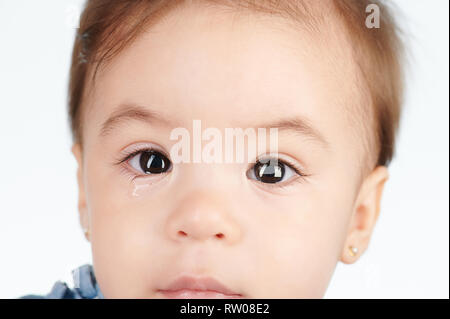 Headshot of crying baby girl isolated on white background Stock Photo