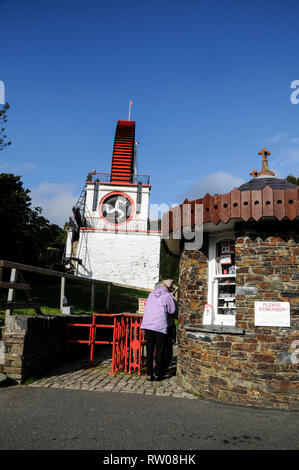 A visitor paying an entrance fee at the main visitorÕs entrance to the famous Laxey Wheel,  the world's greatest industrial water wheel. It is known f Stock Photo