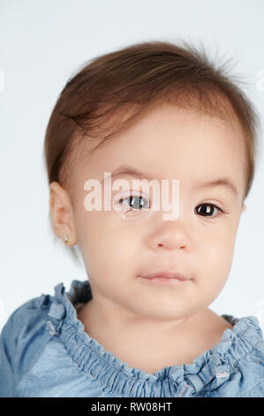 Portrait of crying baby girl isolated on white studio background Stock Photo