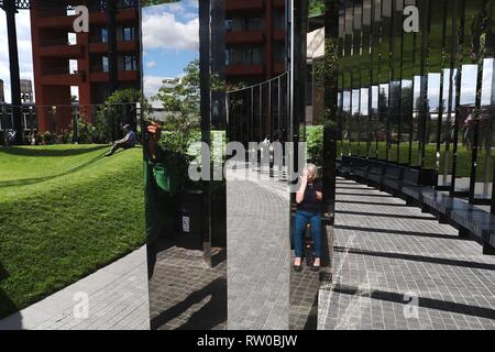 Victorian gas holder encloses new park in King's Cross, London Stock Photo