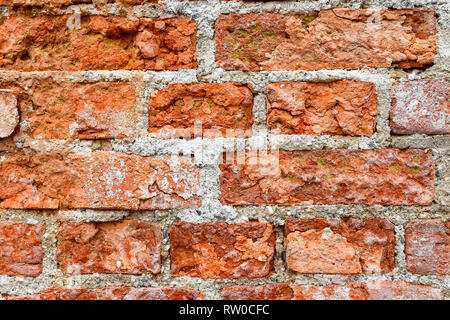 Texture of and old brick wall shaped and destroyed by time Stock Photo
