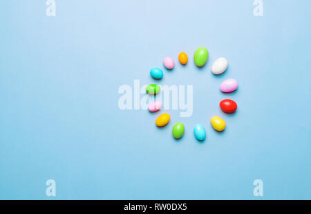 Easter Is Loading, Chocolate Eggs on Bright Background, Festive Easter Concept Stock Photo
