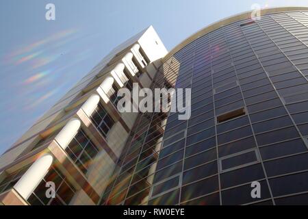 commercial high-rise building in the sun highlights in the city center Stock Photo