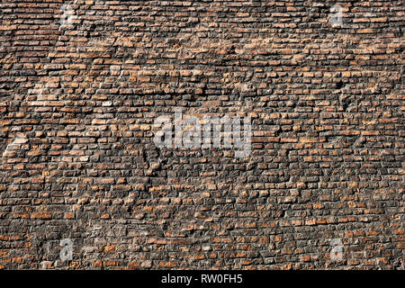 Very old brick wall texture or background, taken in the Old Town of Krakow in Poland. Stock Photo