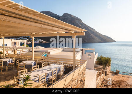 SIFNOS, GREECE - September 10, 2018: Traditional Greek restaurant overlooking the bay of the island of Sifnos. Greece Stock Photo