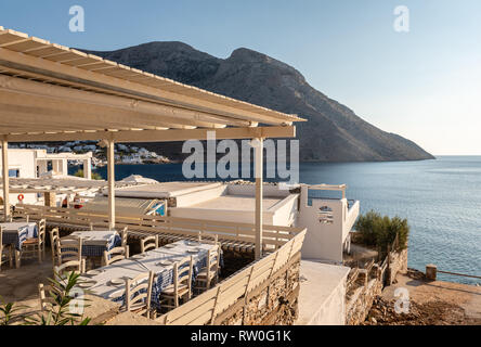 SIFNOS, GREECE - September 10, 2018: Traditional Greek restaurant overlooking the bay of the island of Sifnos. Greece Stock Photo