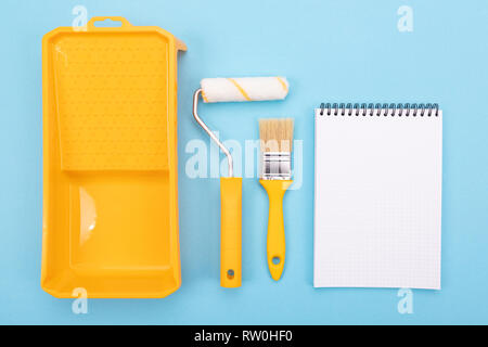 Paint tools. Paint brush and roller with tray for paint Stock Photo