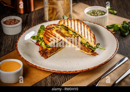 Delicious pulled pork sandwich with cheese sauce Stock Photo