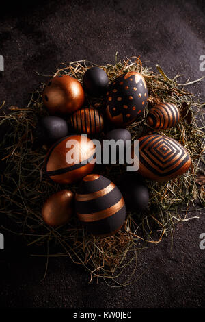 Easter composition with black and gold decorative Easter eggs Stock Photo