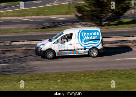 Thames Water van driving on the road at speed. Motion blur Stock Photo