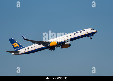 Icelandair Boeing 757 jet airliner plane TF-FIX taking off from London Heathrow Airport, UK, in blue sky. Space for copy