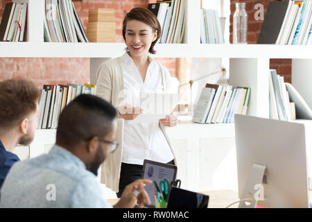 Diverse young professionals working together in modern office Stock Photo