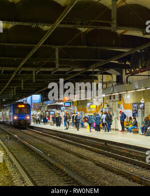 PARIS, FRANCE - NOVEMBER 09, 2018: People at Paris underground metro station. Train arrives. Stock Photo
