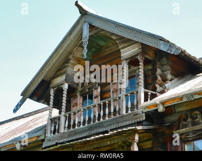 Plinths of windows of wooden houses. Ancient style of decoration of window frames. Stock Photo