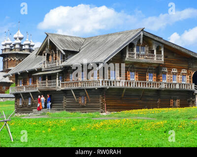 Plinths of windows of wooden houses. Ancient style of decoration of window frames. Stock Photo