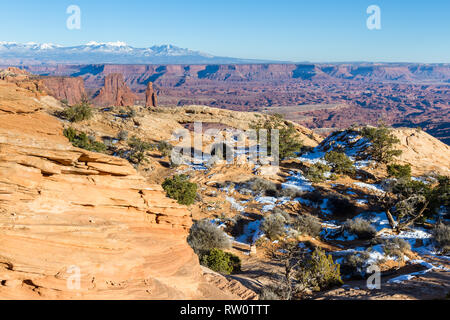 View of Mesa Arch with vast canyon views in the background with a nit of snow in the shadow areas Stock Photo