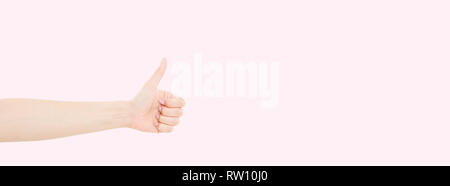 woman with beautiful manicure on fingernails holding hand in gesture of likeness giving thumb up. Close up horizontal color image of human female one  Stock Photo