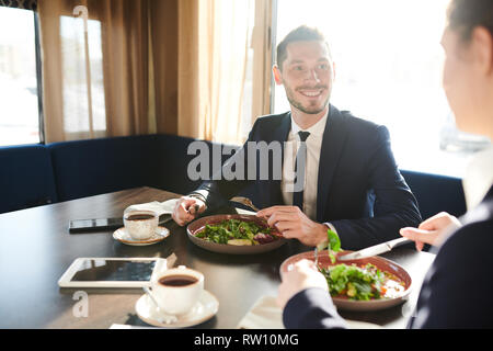 Having salad and tea Stock Photo