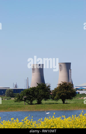 A pair of cooling towers and countryside Stock Photo
