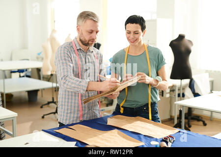 Colleagues in tailoring shop Stock Photo