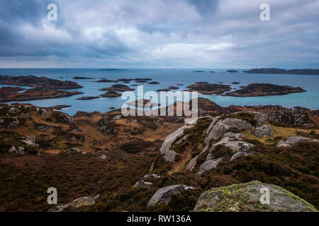 View of the archepelago in the blue hour of the morning from the summit of the Isle of Erraid in the Inner Hebridean islands of Scotland