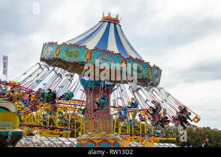 October 7, 2018. Munich, Germany, Oktoberfest, Carousel on cloudy sky background Stock Photo