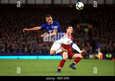 Everton's Richarlison (left) and Liverpool's Andrew Robertson battle for the ball during the Premier League match at Goodison Park, Liverpool. Stock Photo