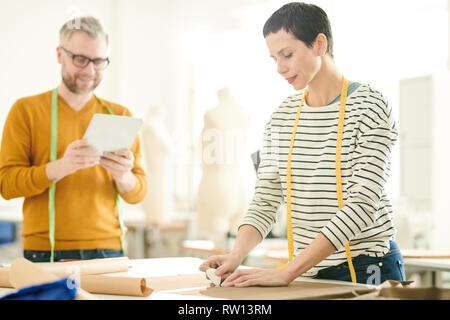 Tailors working in studio Stock Photo