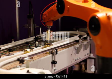 Conveyor system with pick and place robotic arm. Selective focus. Stock Photo