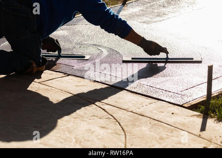 Construction Worker Smoothing Wet Cement With Trowel Tools Stock Photo