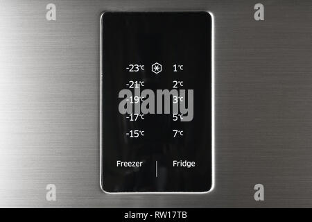 Modern steel colored fridge and freezer control panel. Internet of things abstract concept. Stock Photo