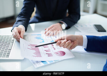 Pointing at financial paper Stock Photo