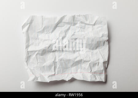 top view of white lined crumpled page on white background Stock Photo