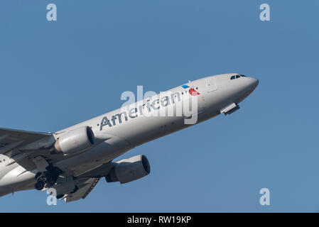 American Airlines Airbus A330 jet airliner plane N274AY taking off from London Heathrow Airport, UK, in blue sky Stock Photo