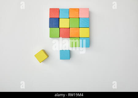top view of multicolored blocks on grey background Stock Photo