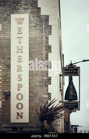 Harwich & Dovercourt, Essex, ENGLAND - March 3, 2019: Exterior of a Wetherspoon pub & restaurant signage in Harwich with focus on the right sign and b Stock Photo