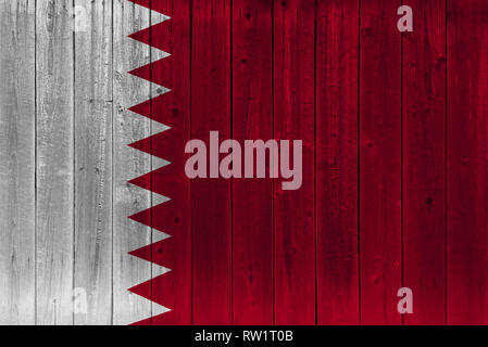 Qatar flag painted on old wood plank. Patriotic background. National flag of Qatar Stock Photo