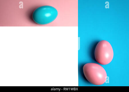 Creative minimalist layout made of eggs and color block background. Flat lay. Easter concept frameing pink blue Stock Photo